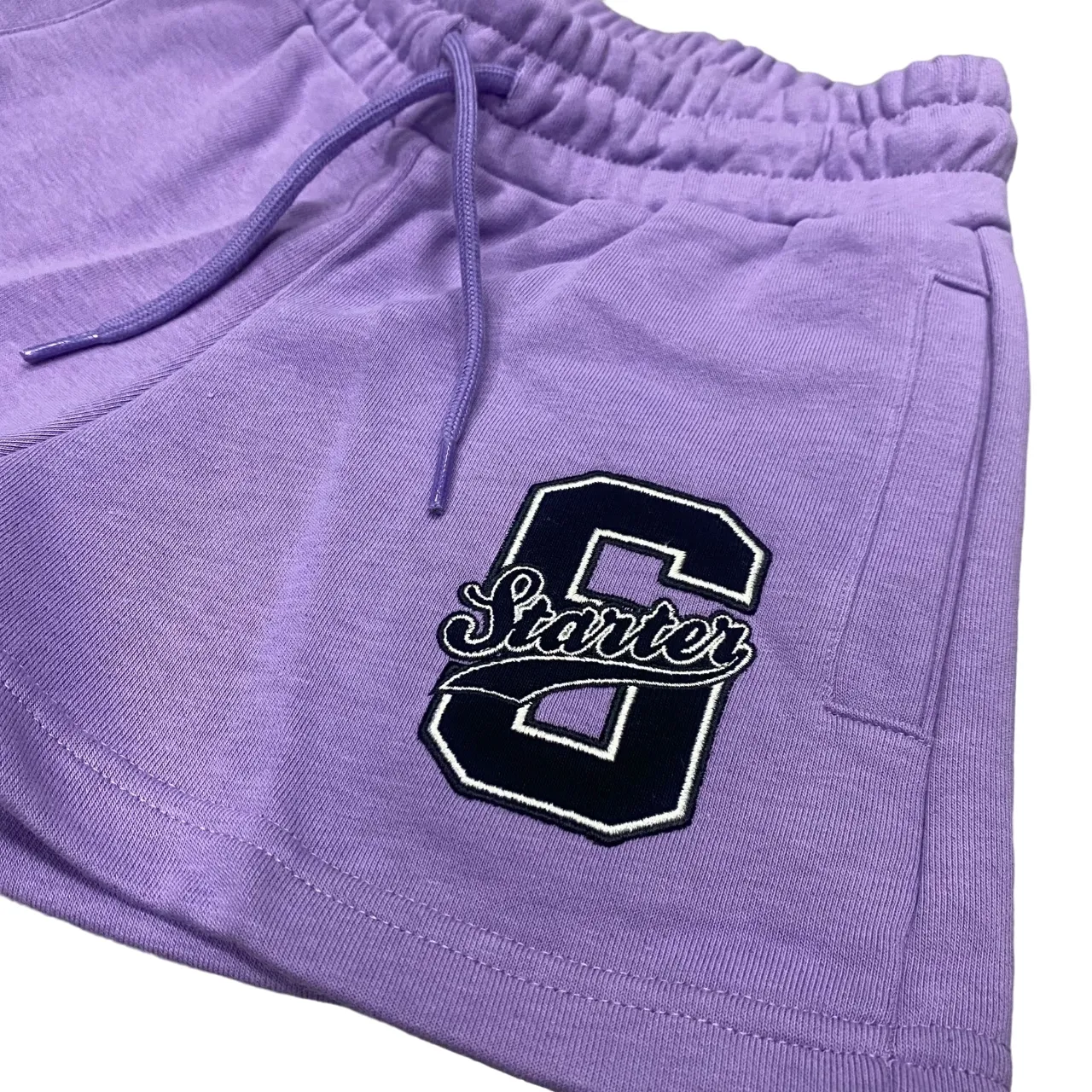 Starter girl's sports shorts with embroidery. Lilac color